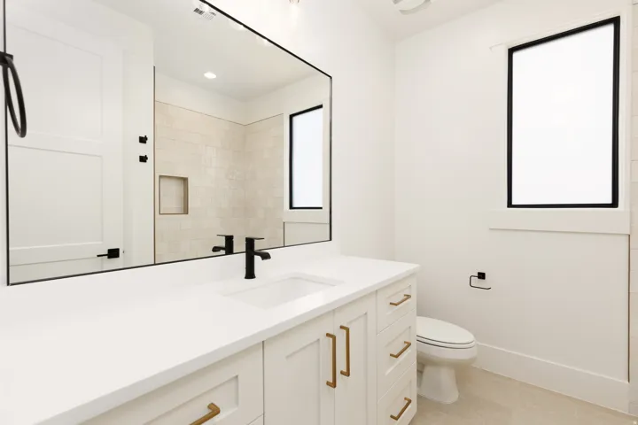 Vanity with integrated sink and matte black faucet