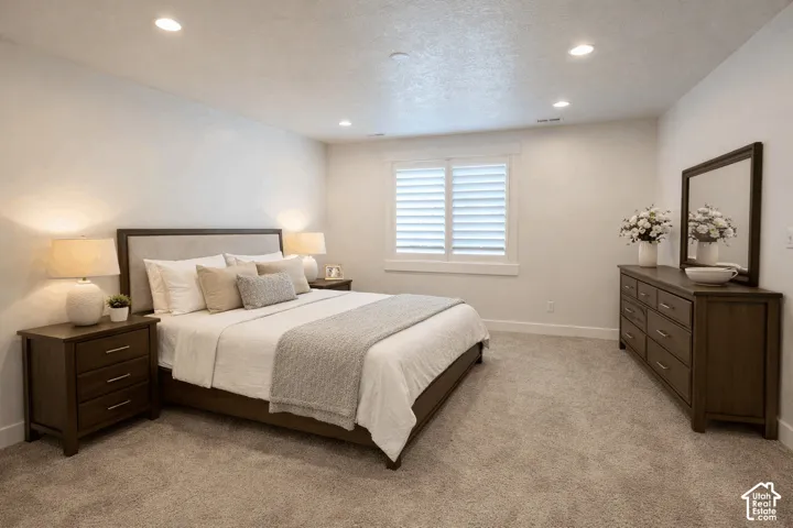 Recessed lighting and a window with plantation shutters