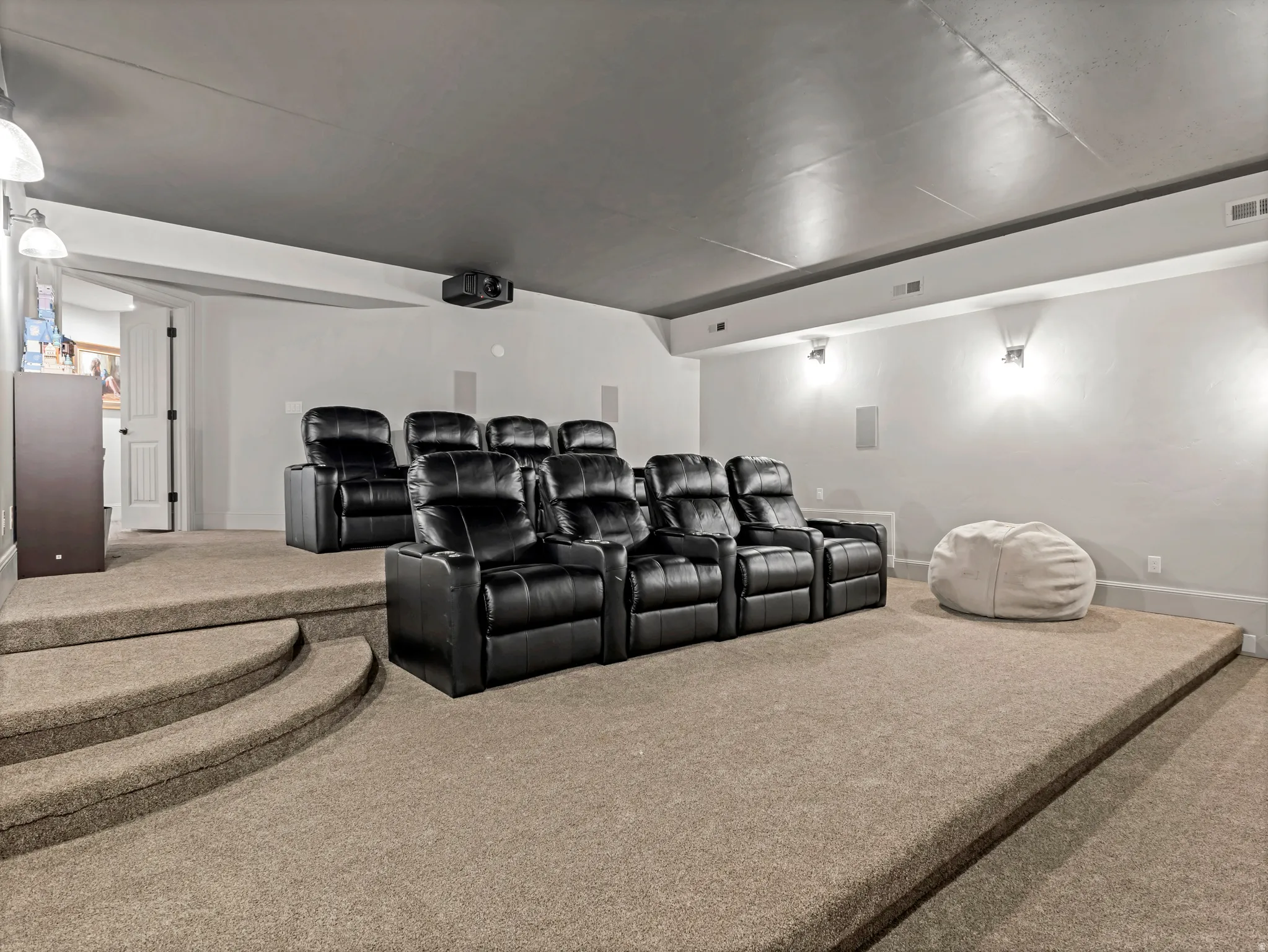 State of the art theater room with eight electric reclining lounge chairs