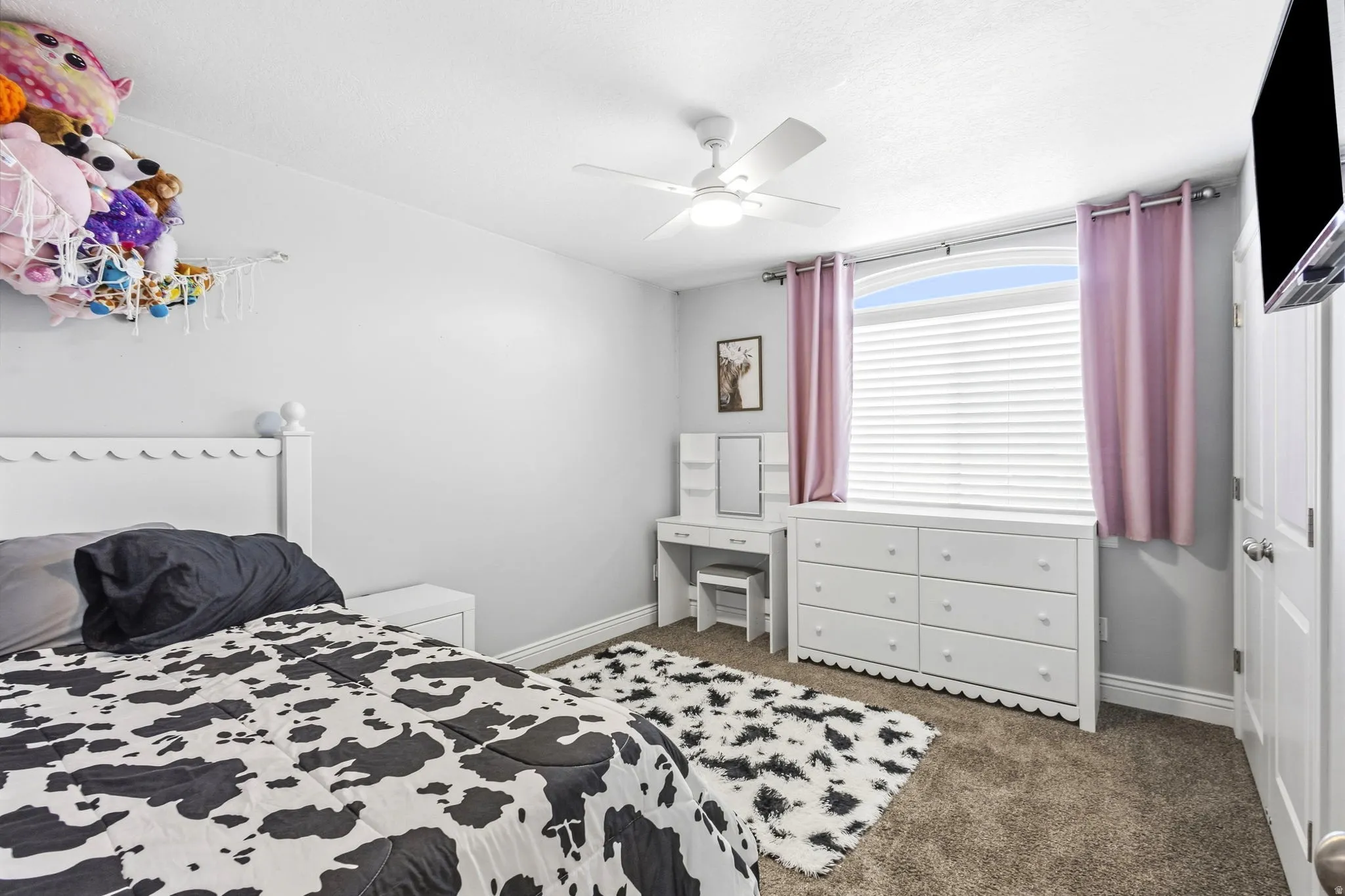 Bedroom #3, White ceiling fan, window with an arched transom, and white window blinds