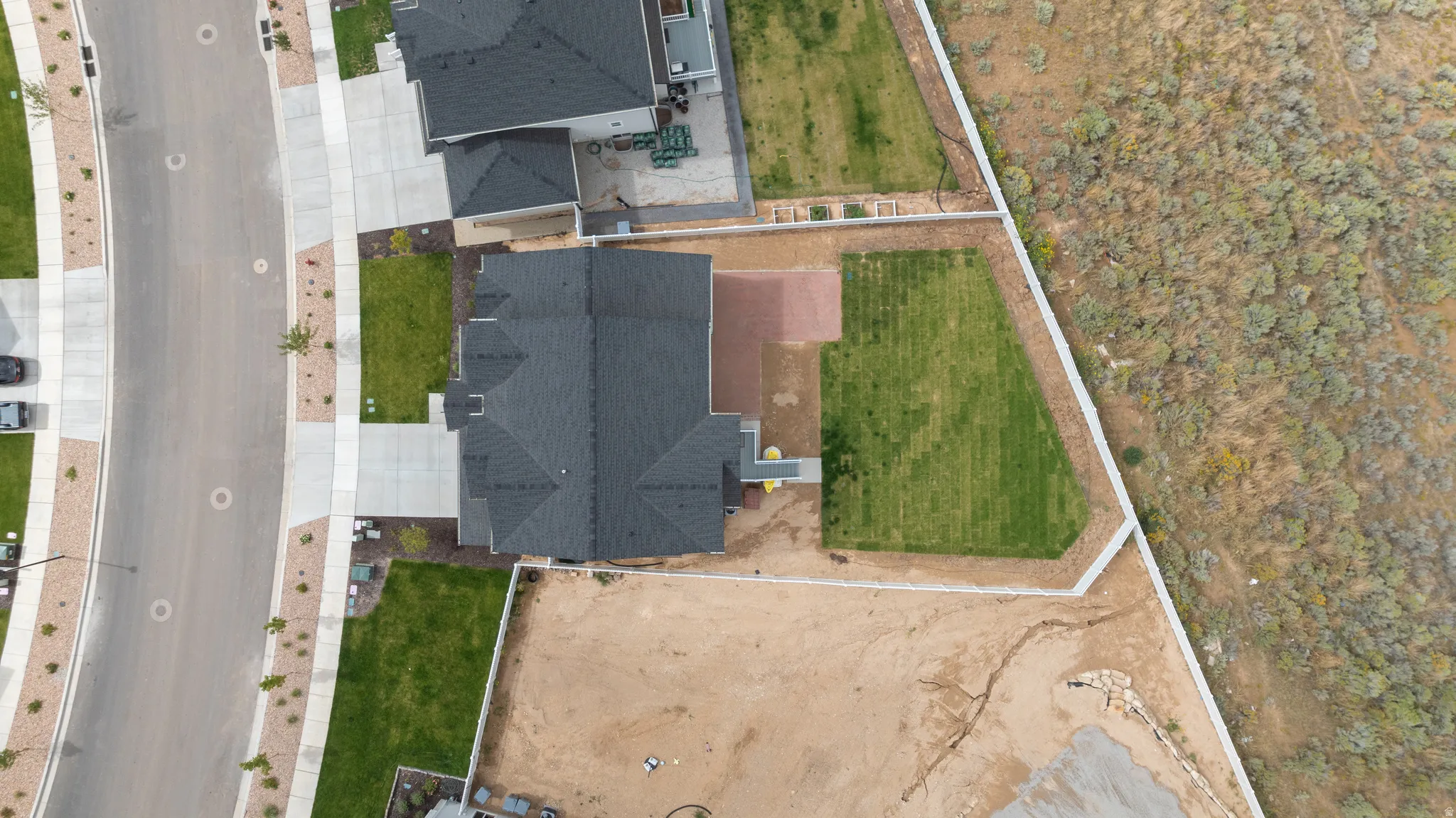 Black shingle roof and light gray siding