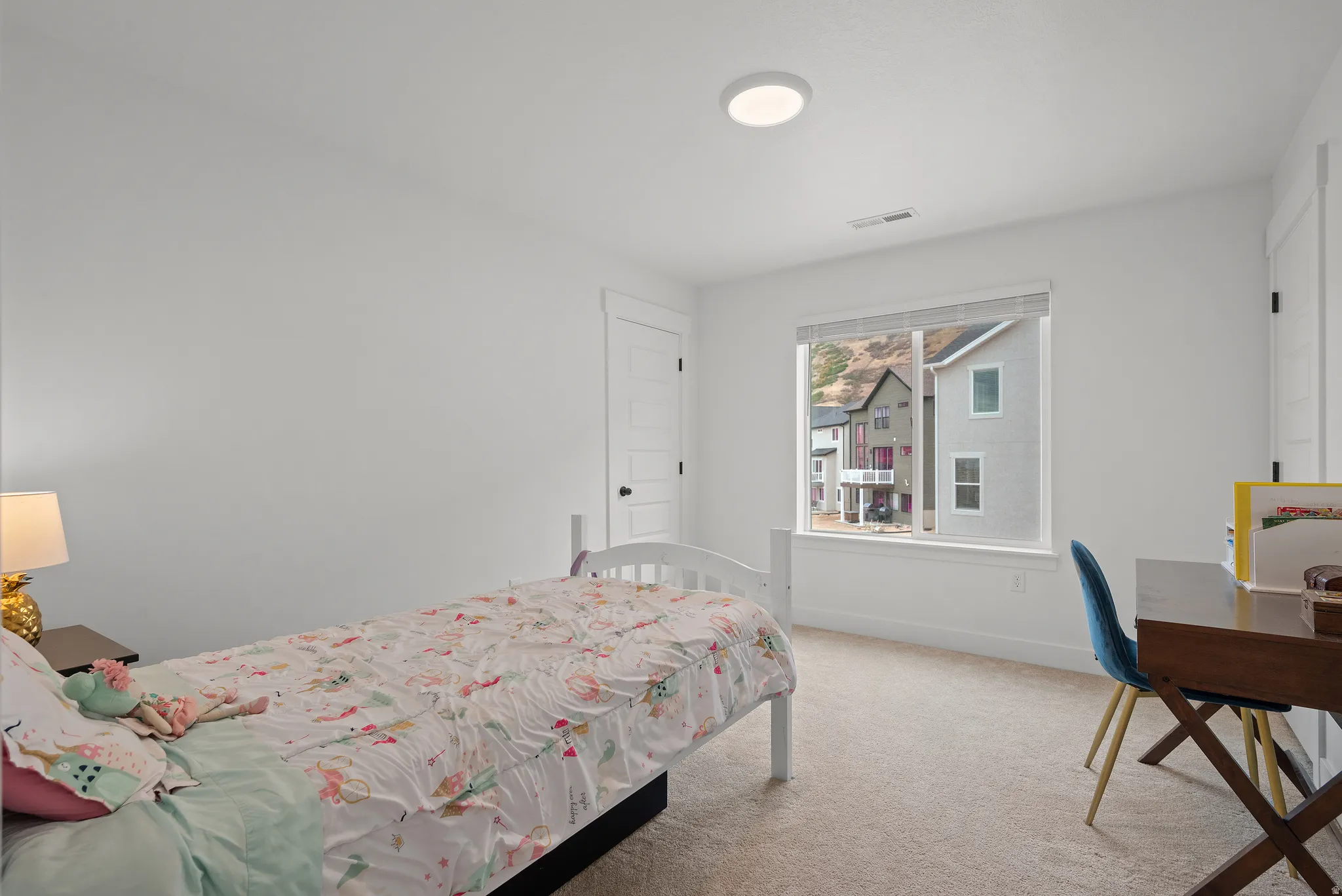 Neutral wall paint, window with blinds, baseboard trim, carpet flooring, and a flush mount ceiling light