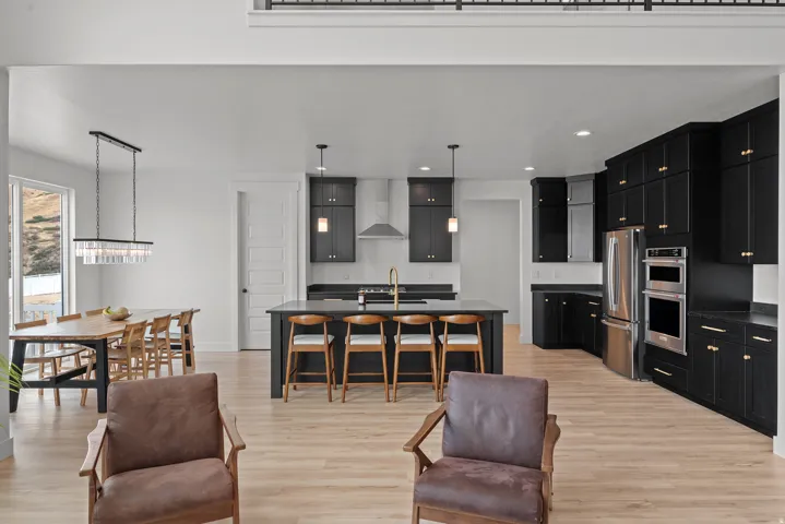 Open-concept living space with light wood-finish flooring