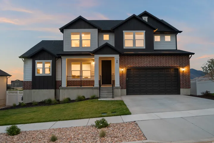 Contemporary two-story exterior with brick and siding facade