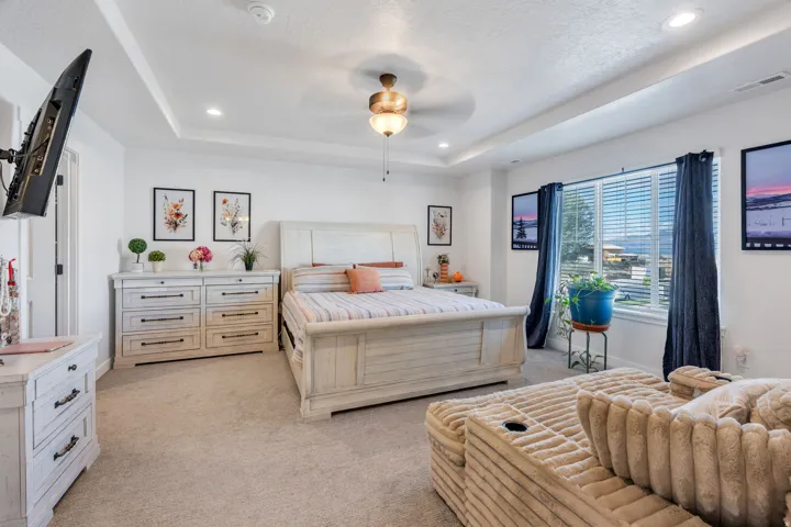 Recessed lighting, tray ceiling, and ceiling fan with light fixture