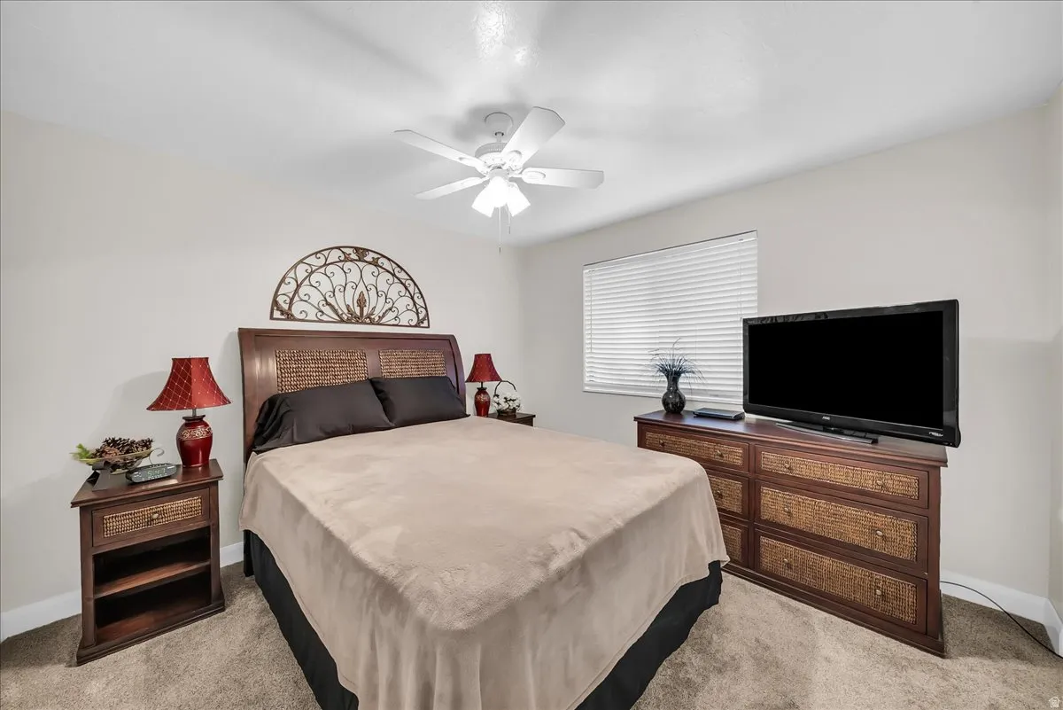 Recessed lighting, ceiling fan, window with blinds, and neutral wall color