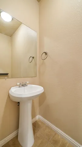 Pedestal sink with chrome-finish faucet