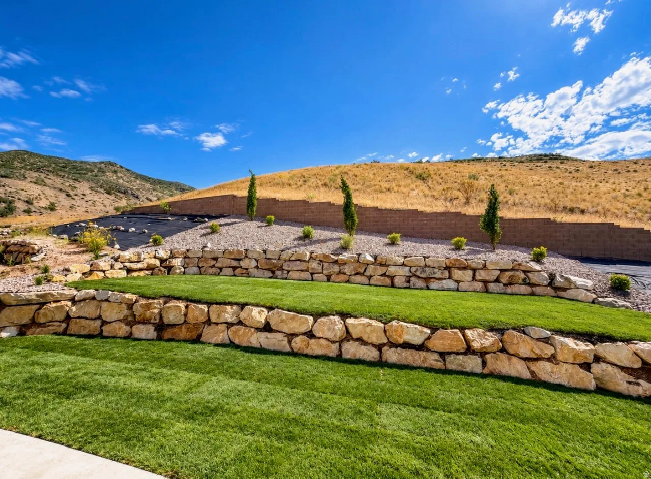 Tiered landscaping with natural stone retaining walls