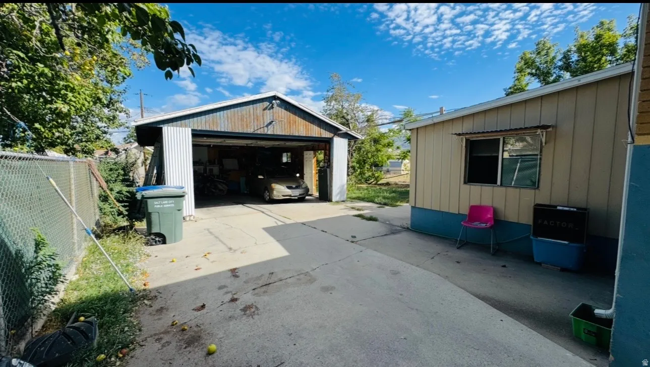 Detached two-car carport with corrugated metal siding