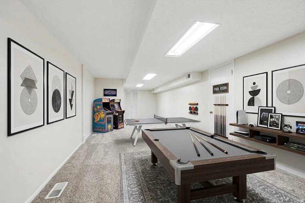 Finished lower level with recessed lighting and neutral carpeting