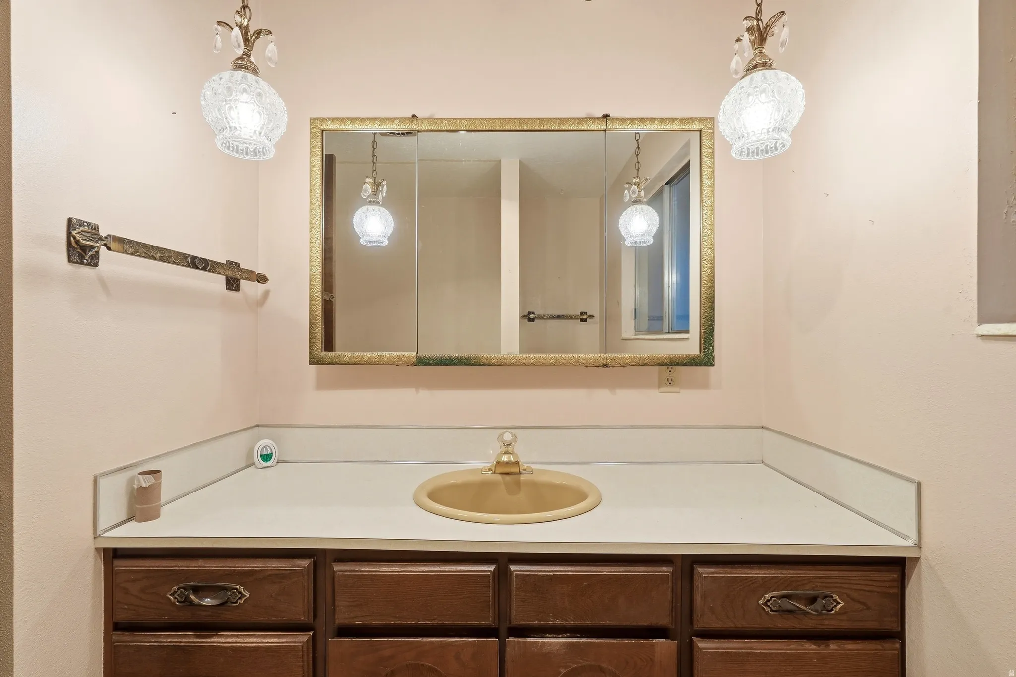 Wood-finish vanity with drawer storage and under-sink cabinetry