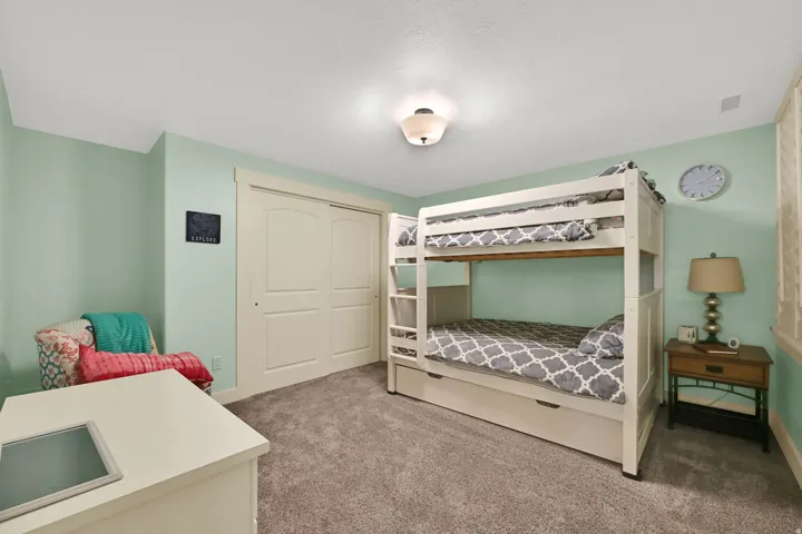 Light green wall paint with a semi-flush ceiling light