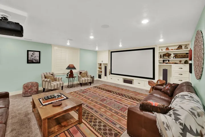 Integrated projection screen with built-in media cabinetry