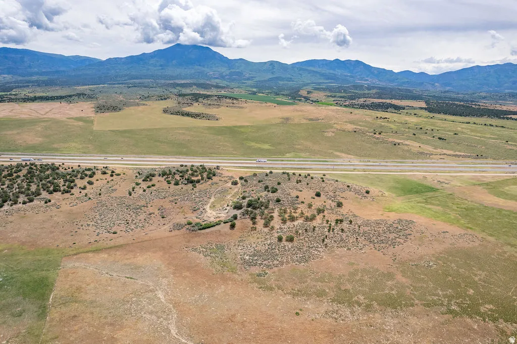 Expansive natural landscape with varied terrain and distant mountain ranges