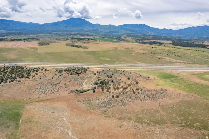 Expansive natural landscape with varied terrain and distant mountain ranges