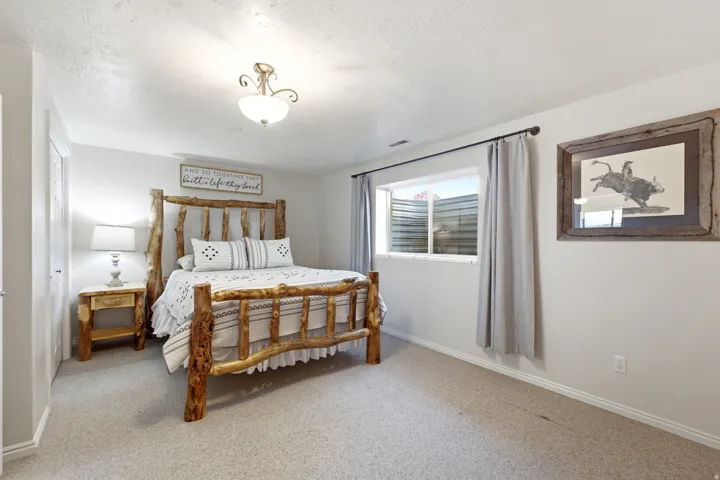 Carpeted flooring, recessed window, and overhead lighting fixture