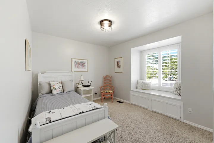 Recessed window with plantation shutters and integrated storage bench