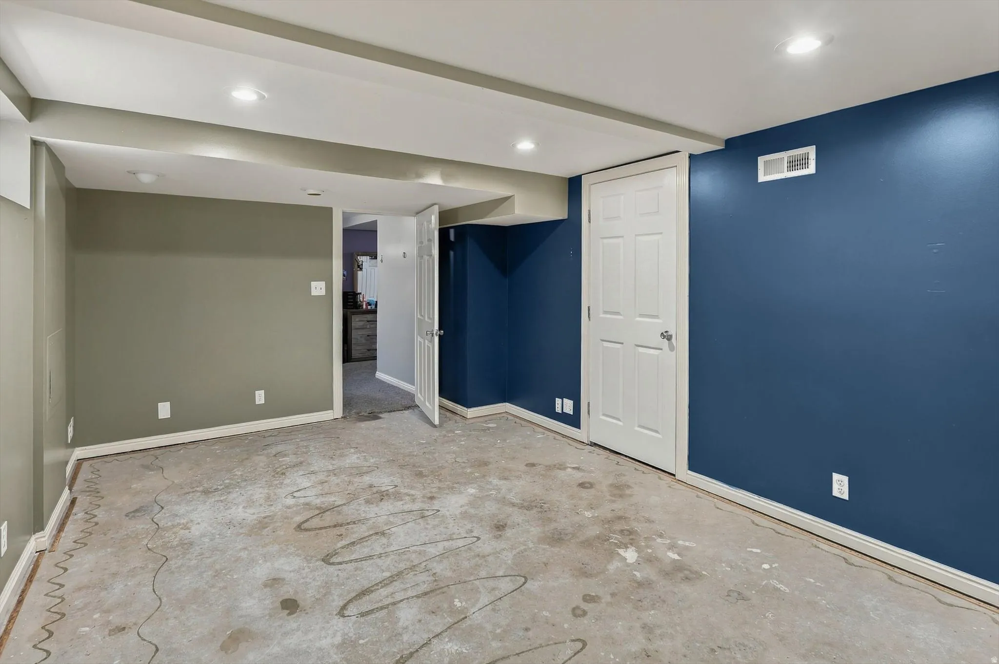 Recessed lighting, painted walls, and white trim throughout
