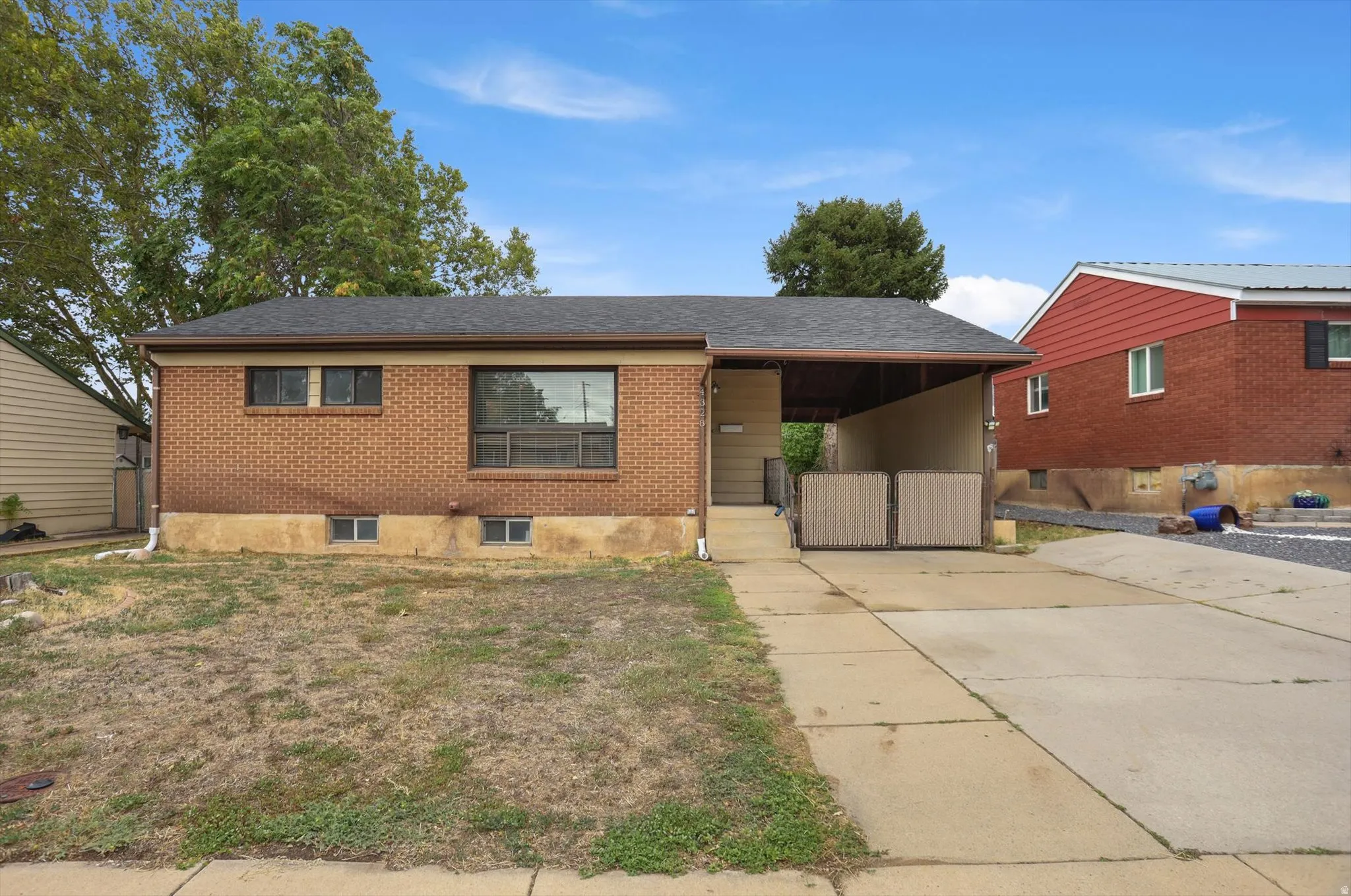 Brick exterior with a dark-shingle roof