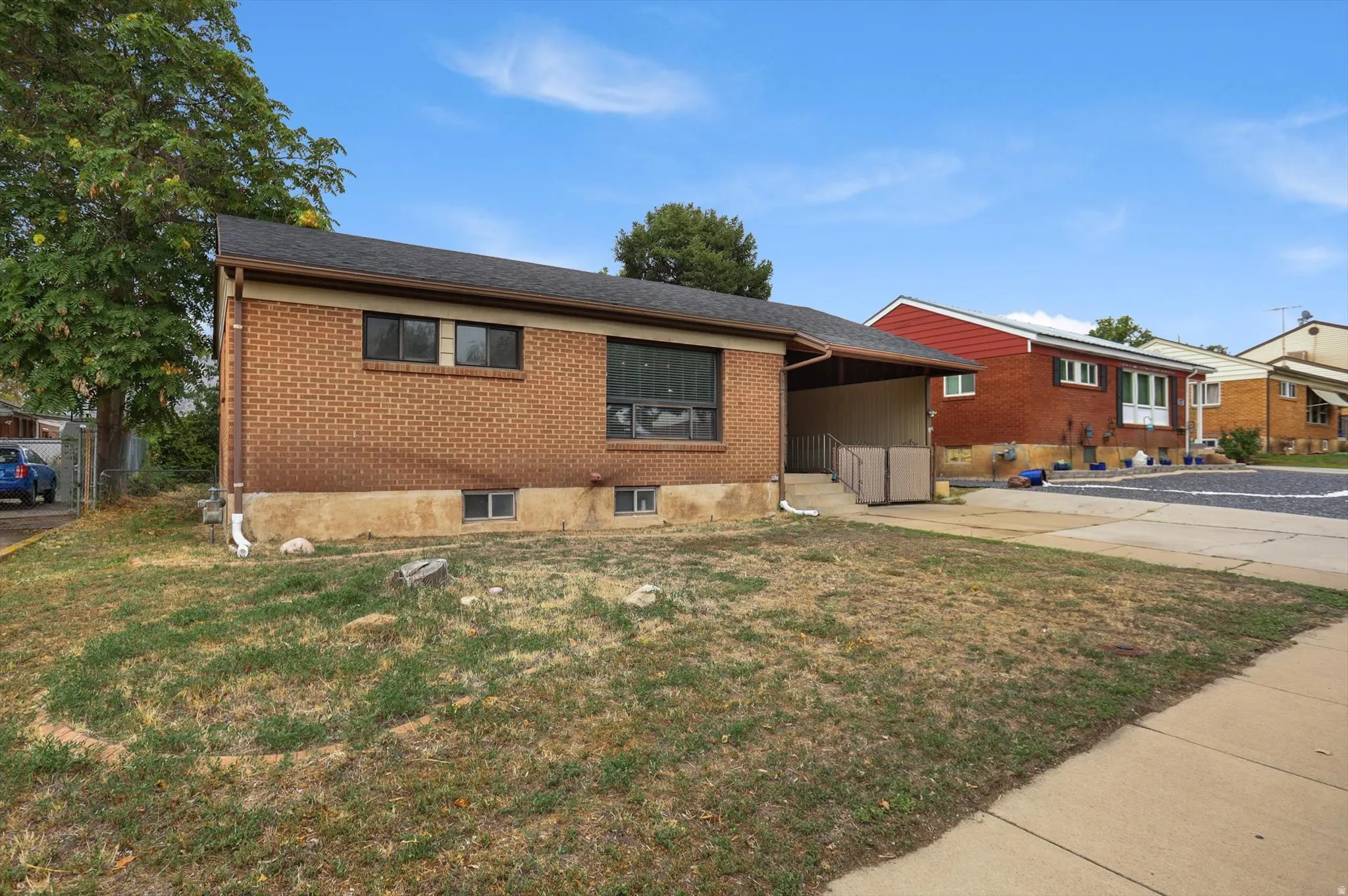 Brick exterior with dark trim windows