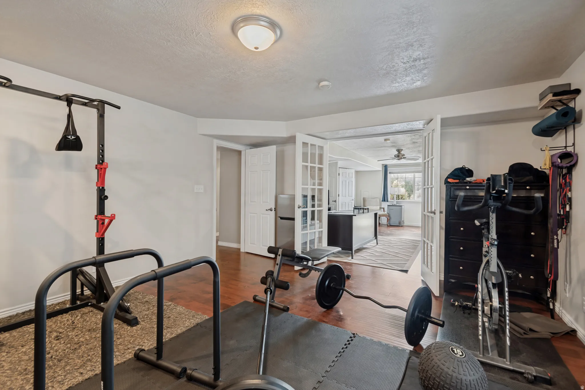 Wood-finish flooring throughout, with a recessed ceiling light fixture