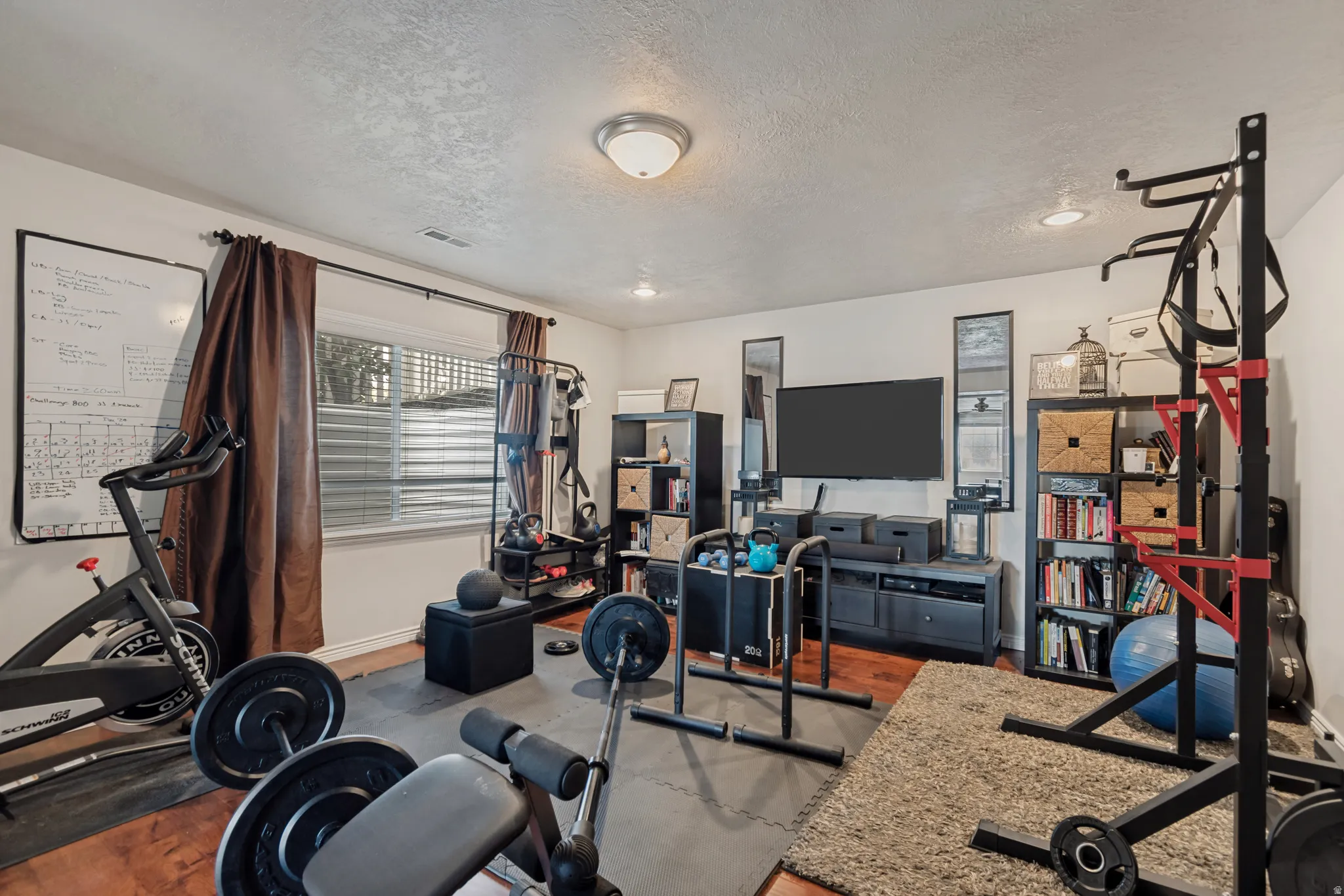 Recessed lighting, wood-finish flooring, and built-in shelving