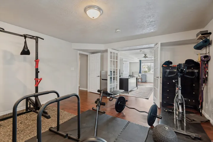 Wood-finish flooring throughout, with a recessed ceiling light fixture