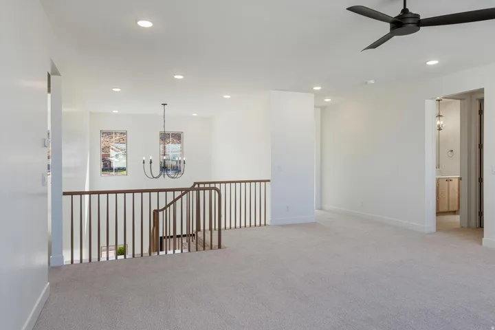 Family Room/Loft area with light carpeting, recessed ceiling lighting, and a contemporary black ceiling fan