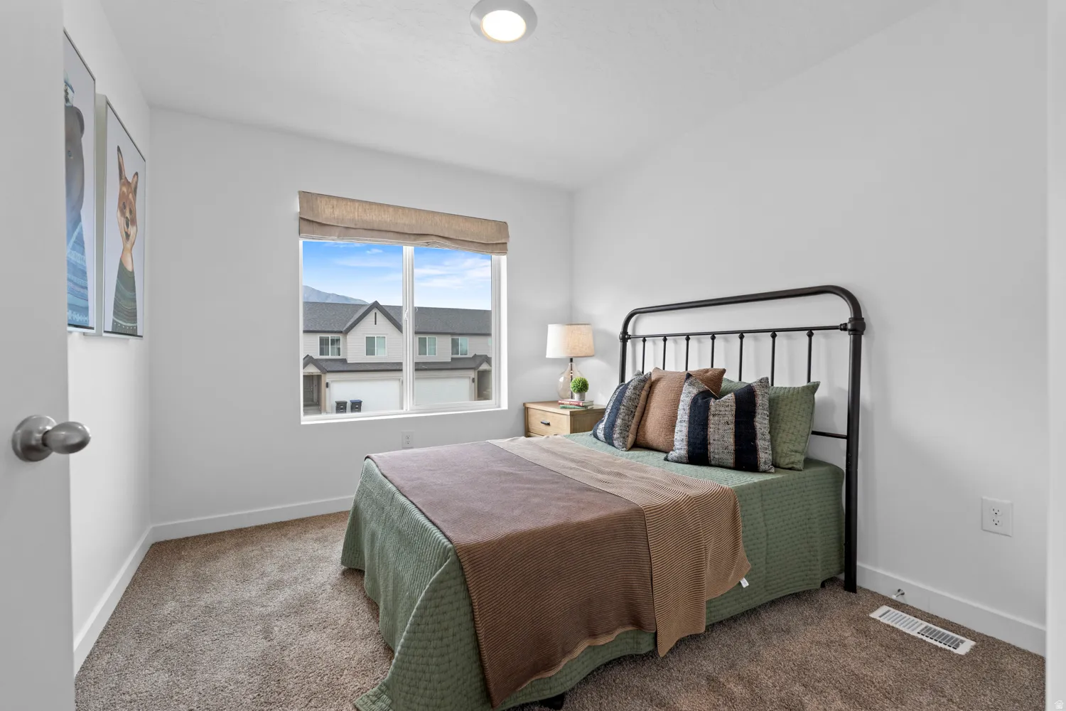 Wall-to-wall carpeting and a ceiling-mounted light fixture