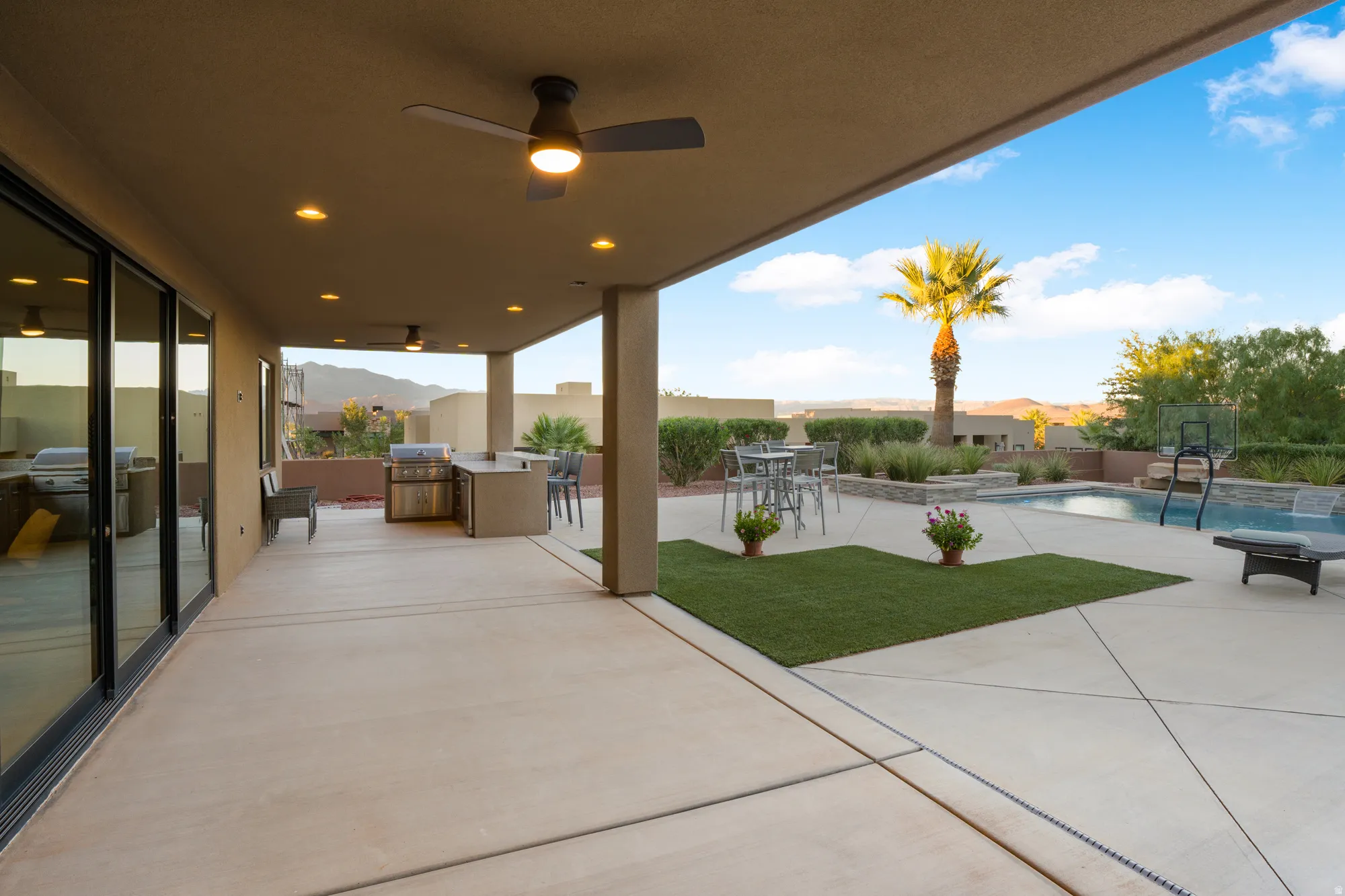 Covered patio with recessed lighting and ceiling fans