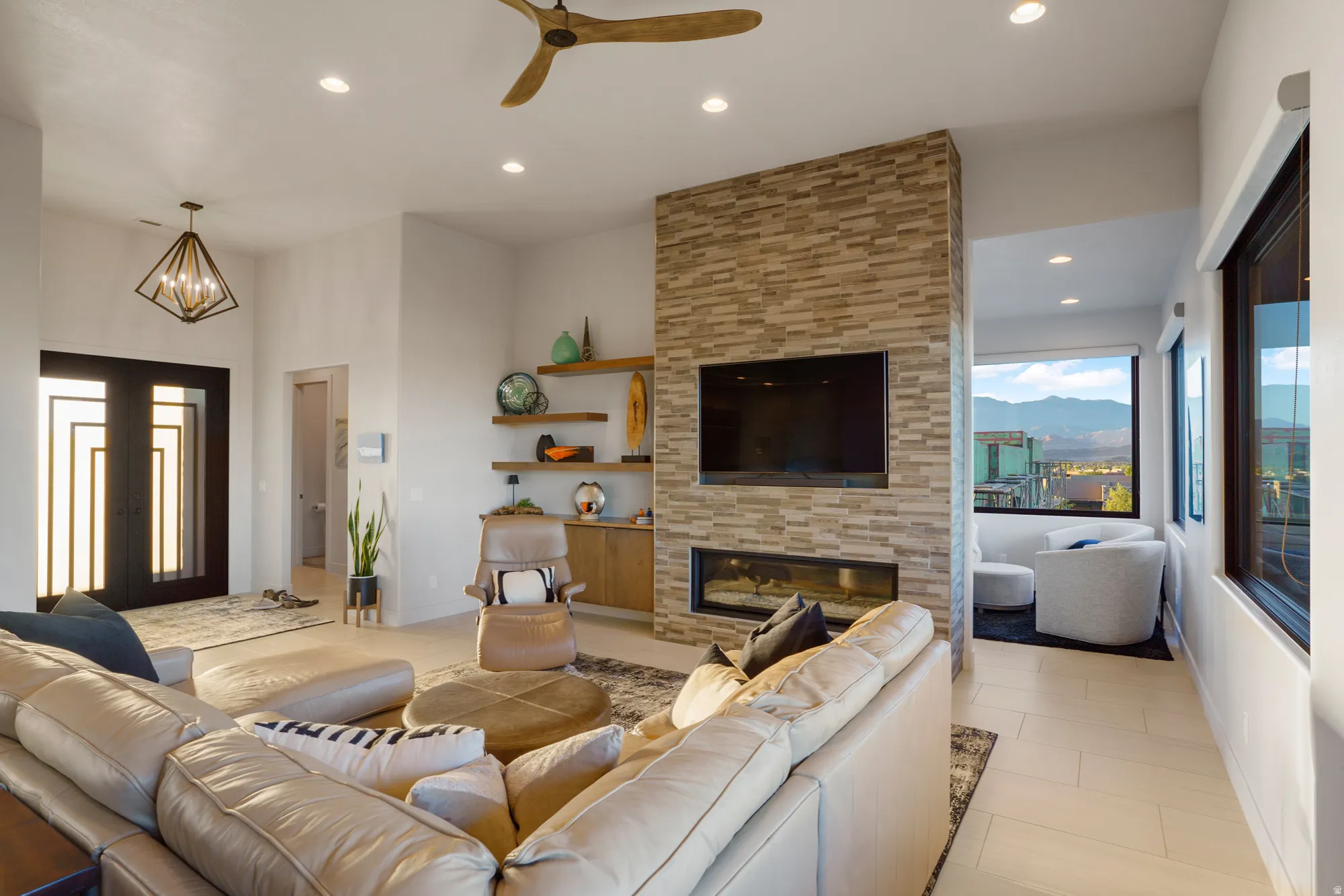 Stacked stone fireplace with an integrated linear fire feature