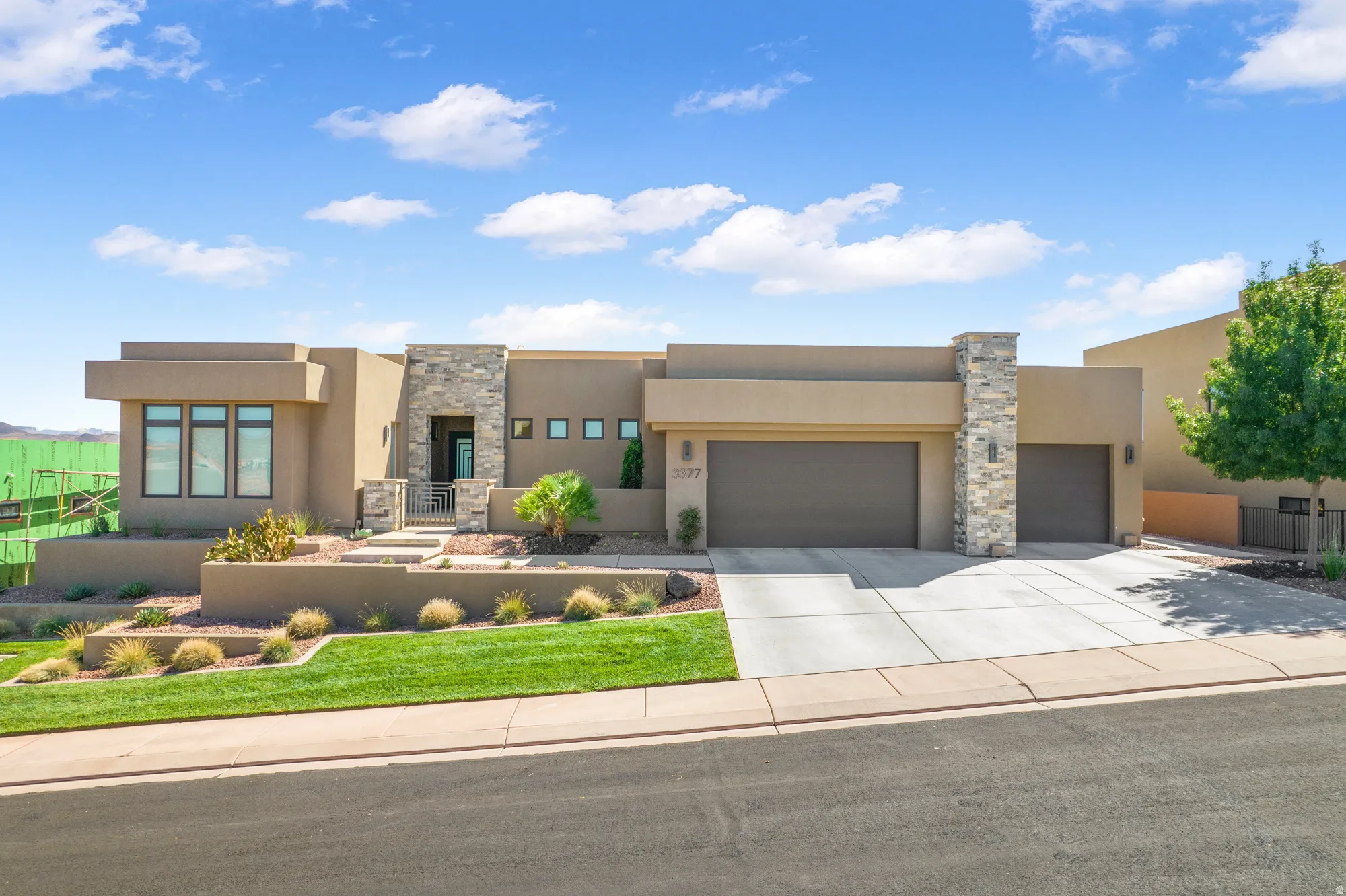 Contemporary stucco exterior with stone accents