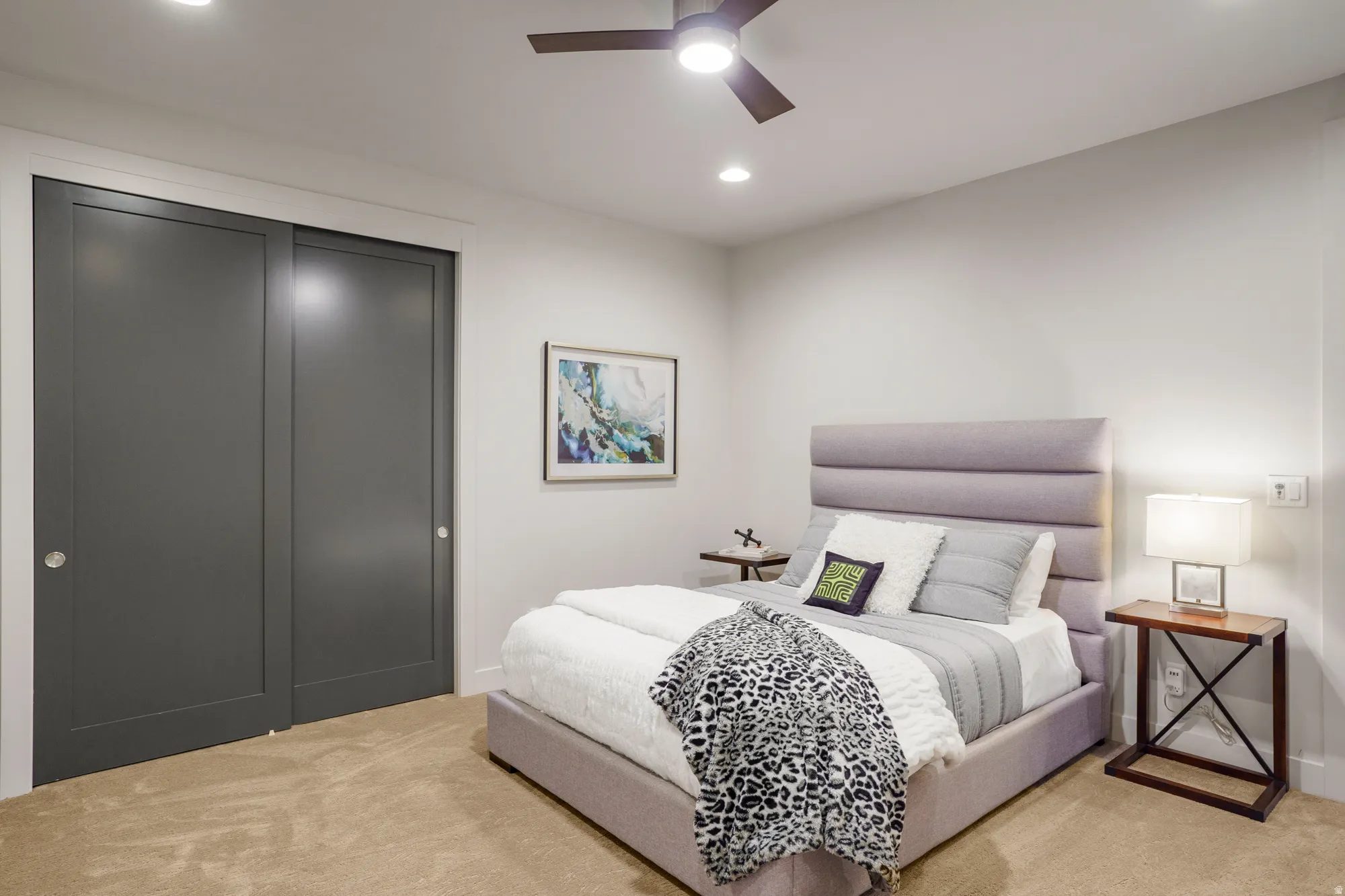 Recessed lighting, ceiling fan with integrated light, carpeted flooring, and sliding closet doors