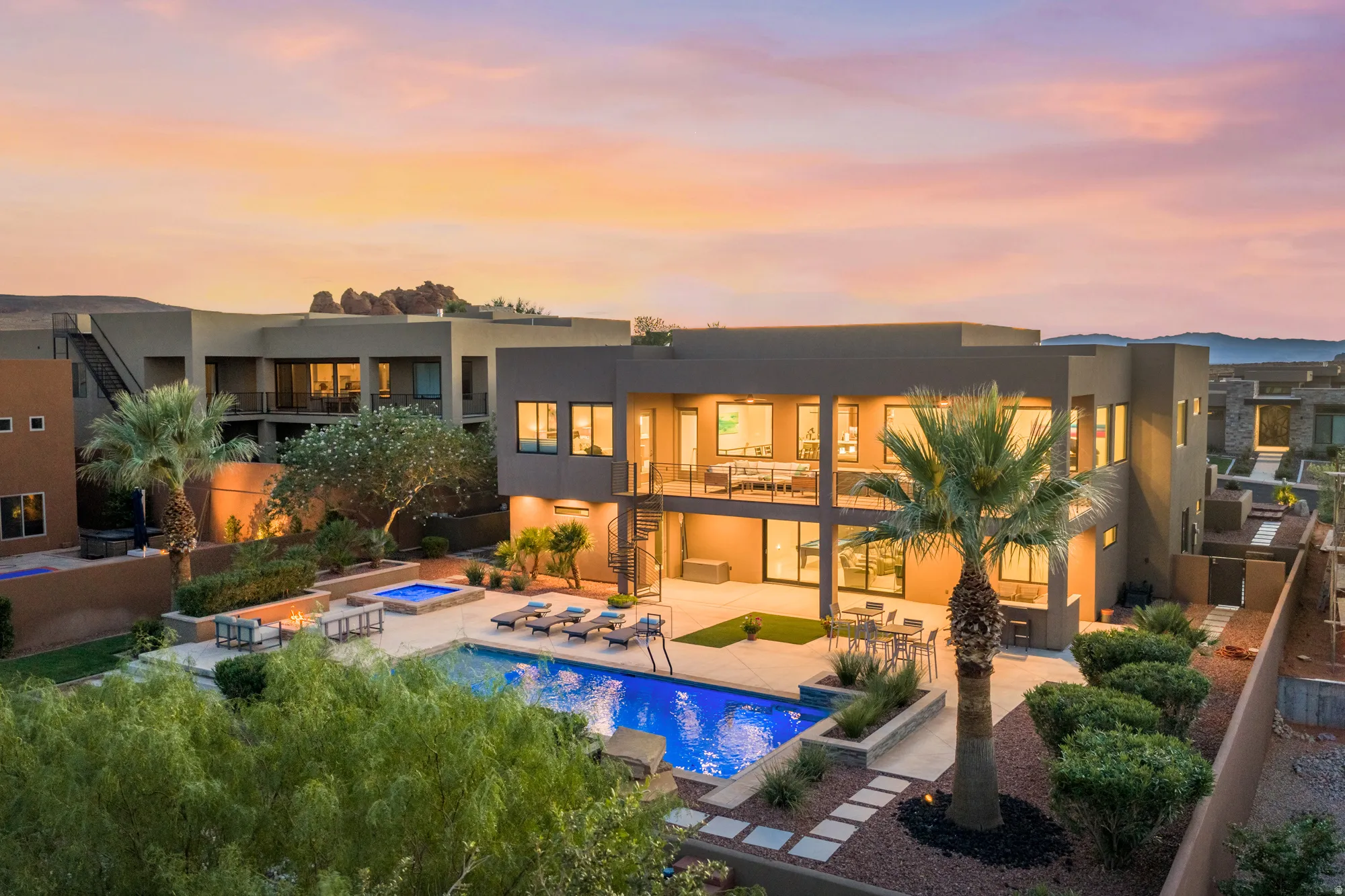 Modern exterior architecture, integrated swimming pool, elevated spa, multiple balconies, and a spiral exterior staircase