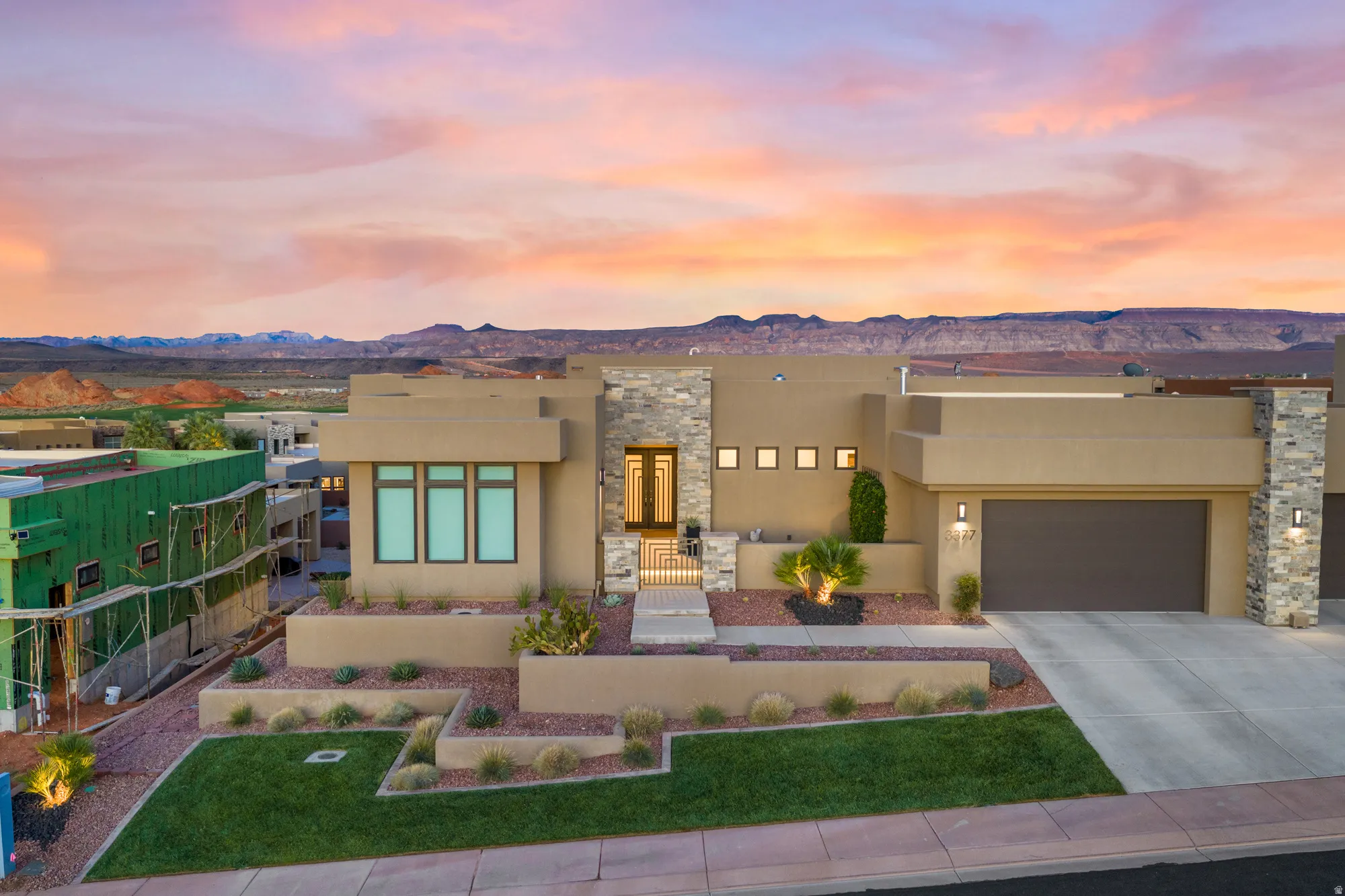 Modern architecture with an earth-toned stucco facade and stone accents