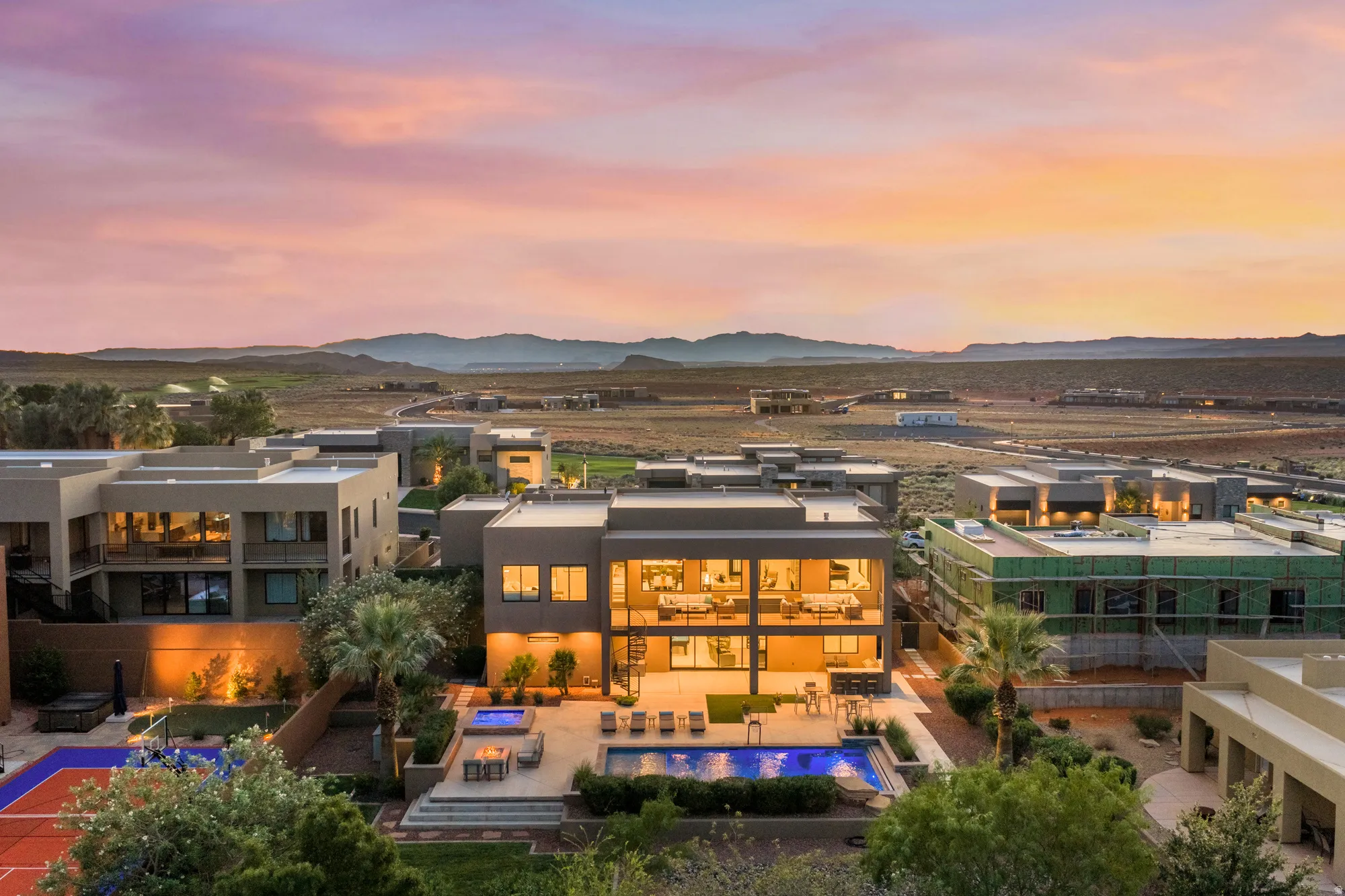 Modern multi-level residence featuring expansive windows, an integrated swimming pool, and a dedicated sports court