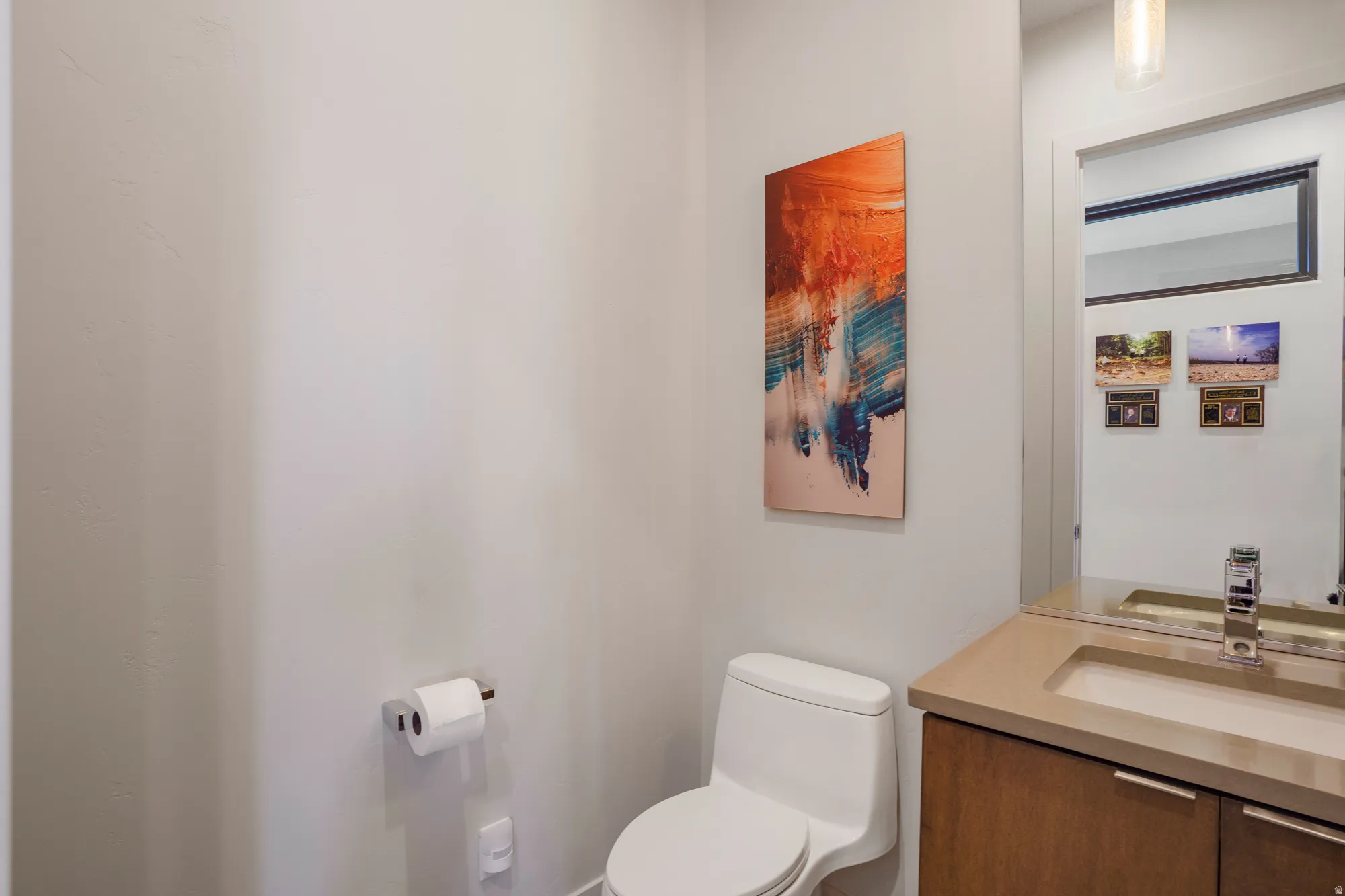Wall-mounted mirror with an integrated light fixture