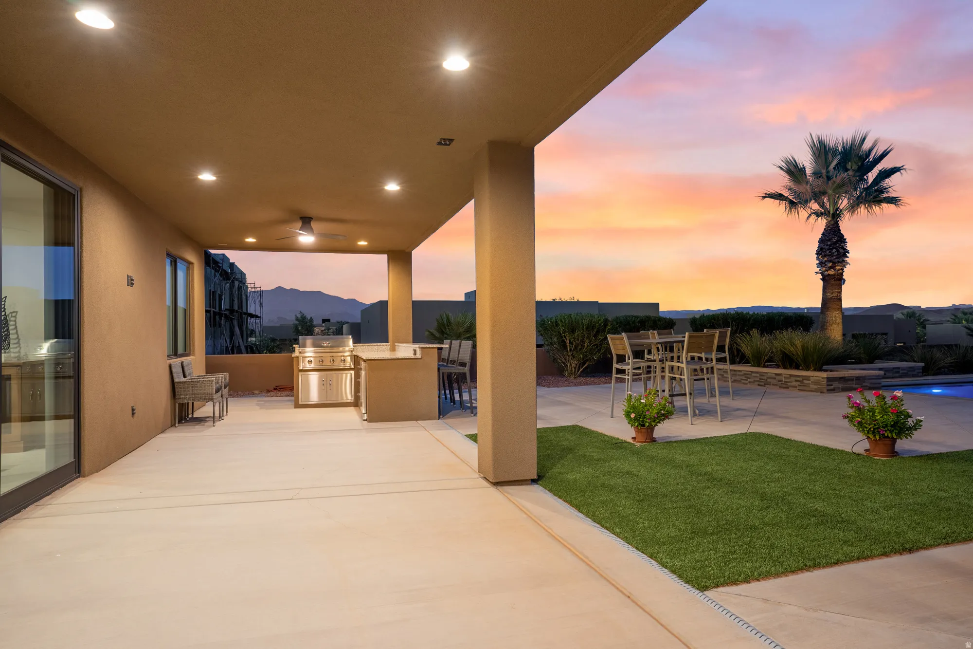 Expansive covered patio with recessed lighting and ceiling fan