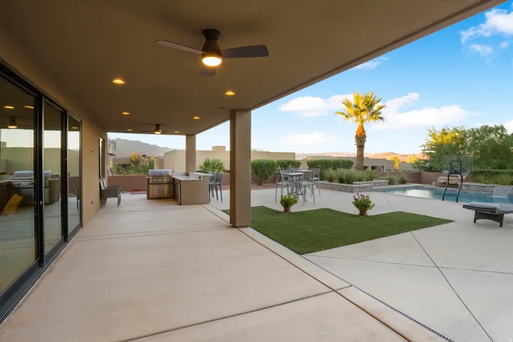 Covered patio with recessed lighting and ceiling fans