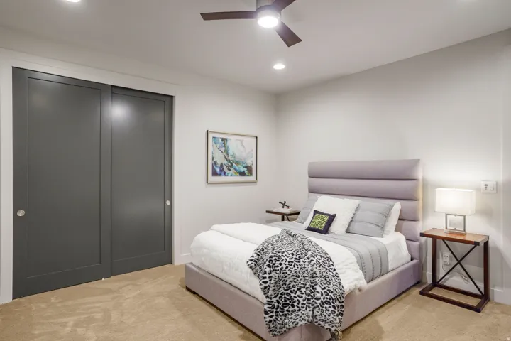 Recessed lighting, ceiling fan with integrated light, carpeted flooring, and sliding closet doors