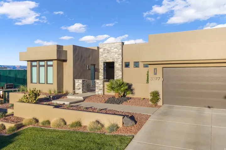 Contemporary stucco exterior with stone accents
