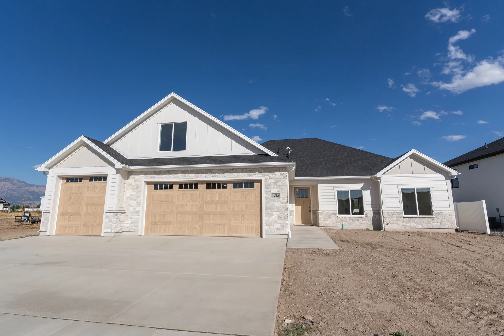 Contemporary exterior featuring stone veneer and horizontal siding