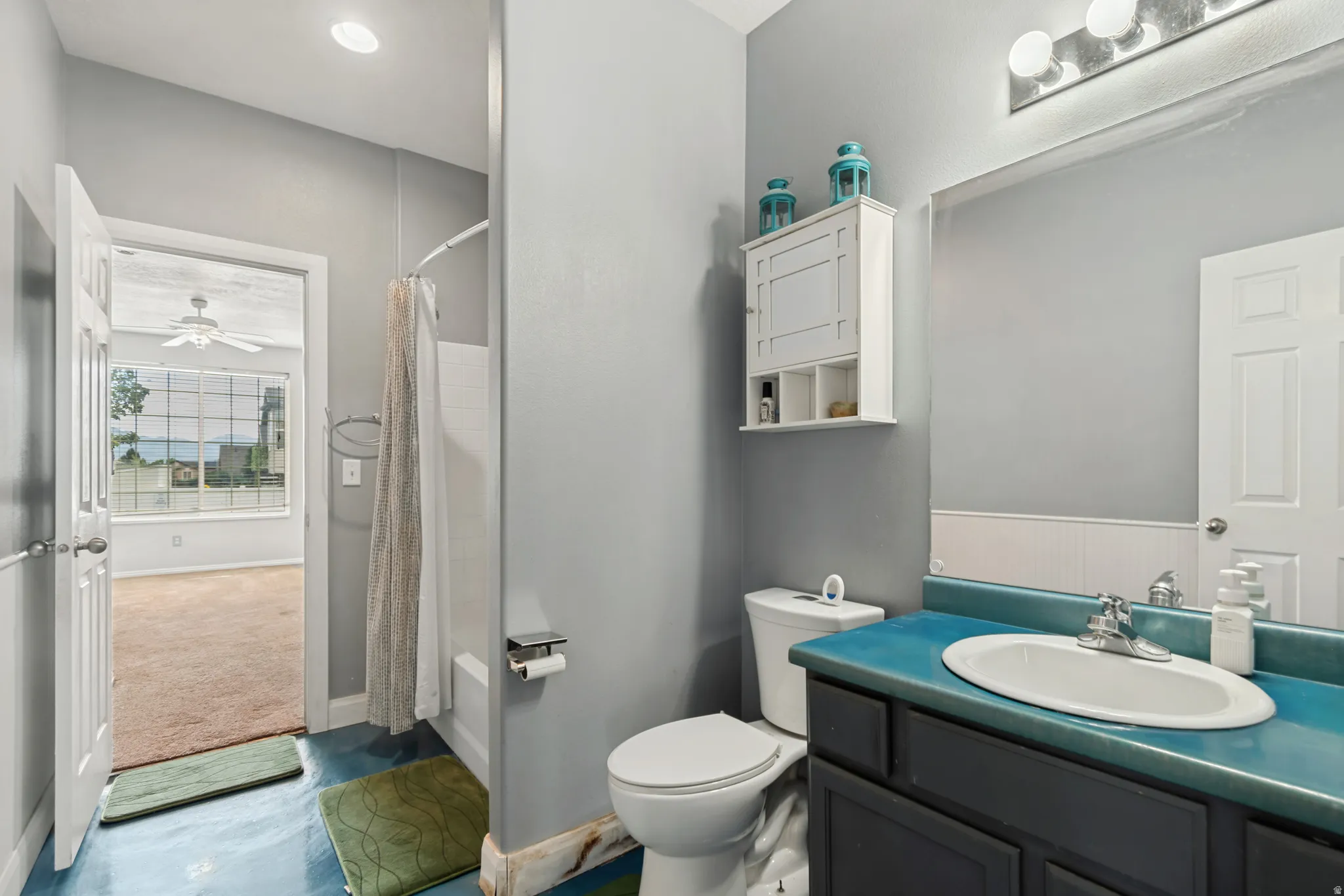 Integrated vanity with a single basin and blue countertop