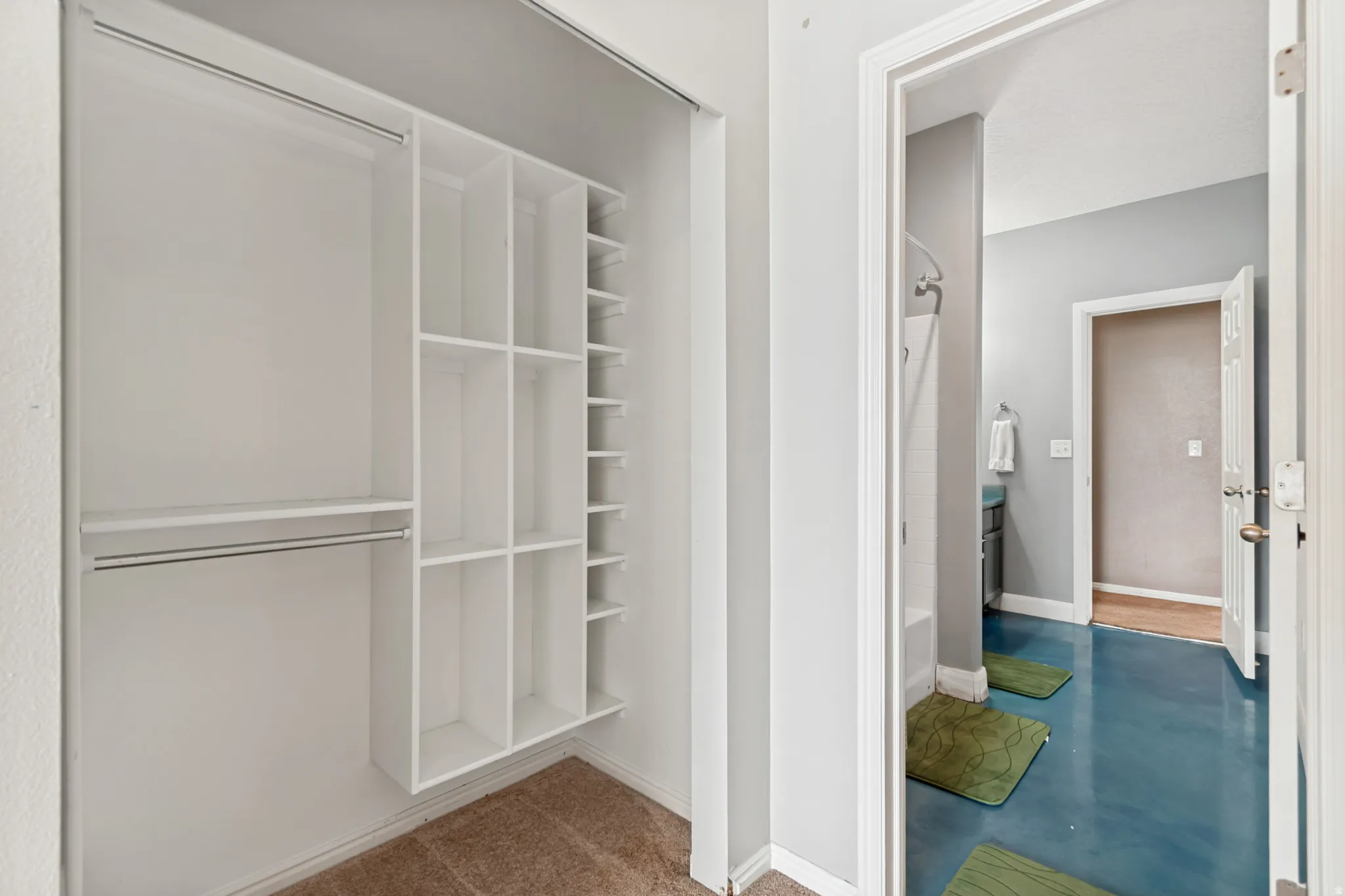 Built-in closet organization system with shelving and hanging rods