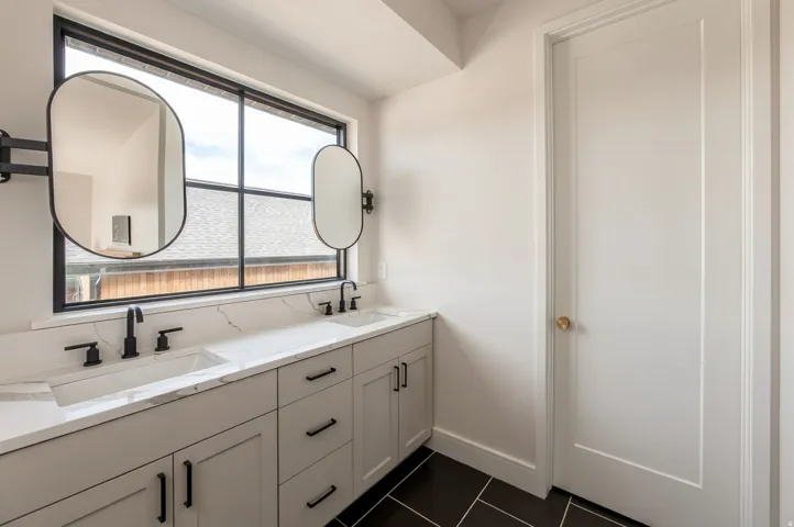 Dual vanity with integrated sinks and matte black fixtures