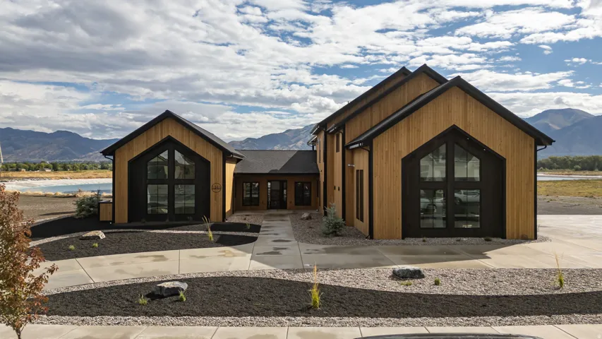 Modern exterior with natural wood-finish siding and dark trim