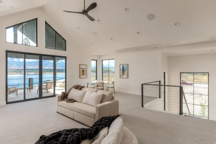Vaulted ceilings featuring a ceiling fan and recessed lighting