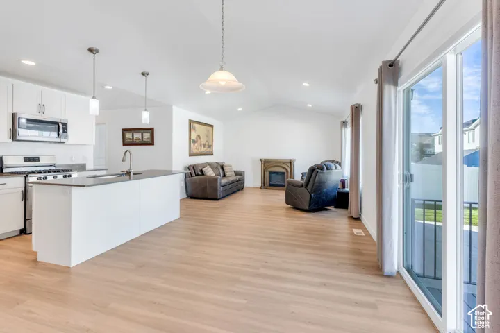 Open concept living at its best. Vaulted ceilings, large windows, make this a place flooded with light and warmth.