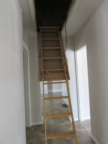 Pull-down attic access ladder