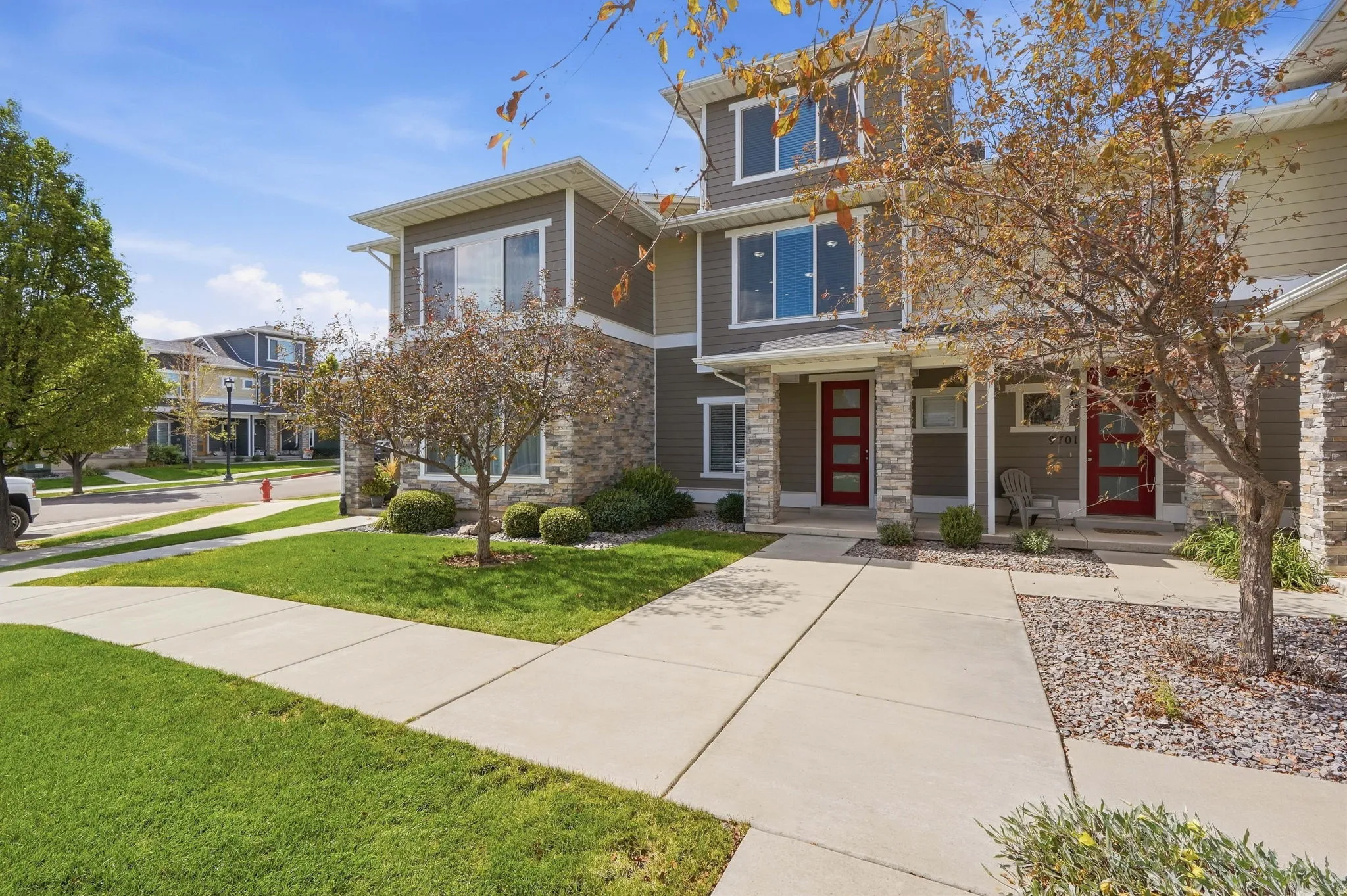 Modern multi-story exterior with stone and siding accents